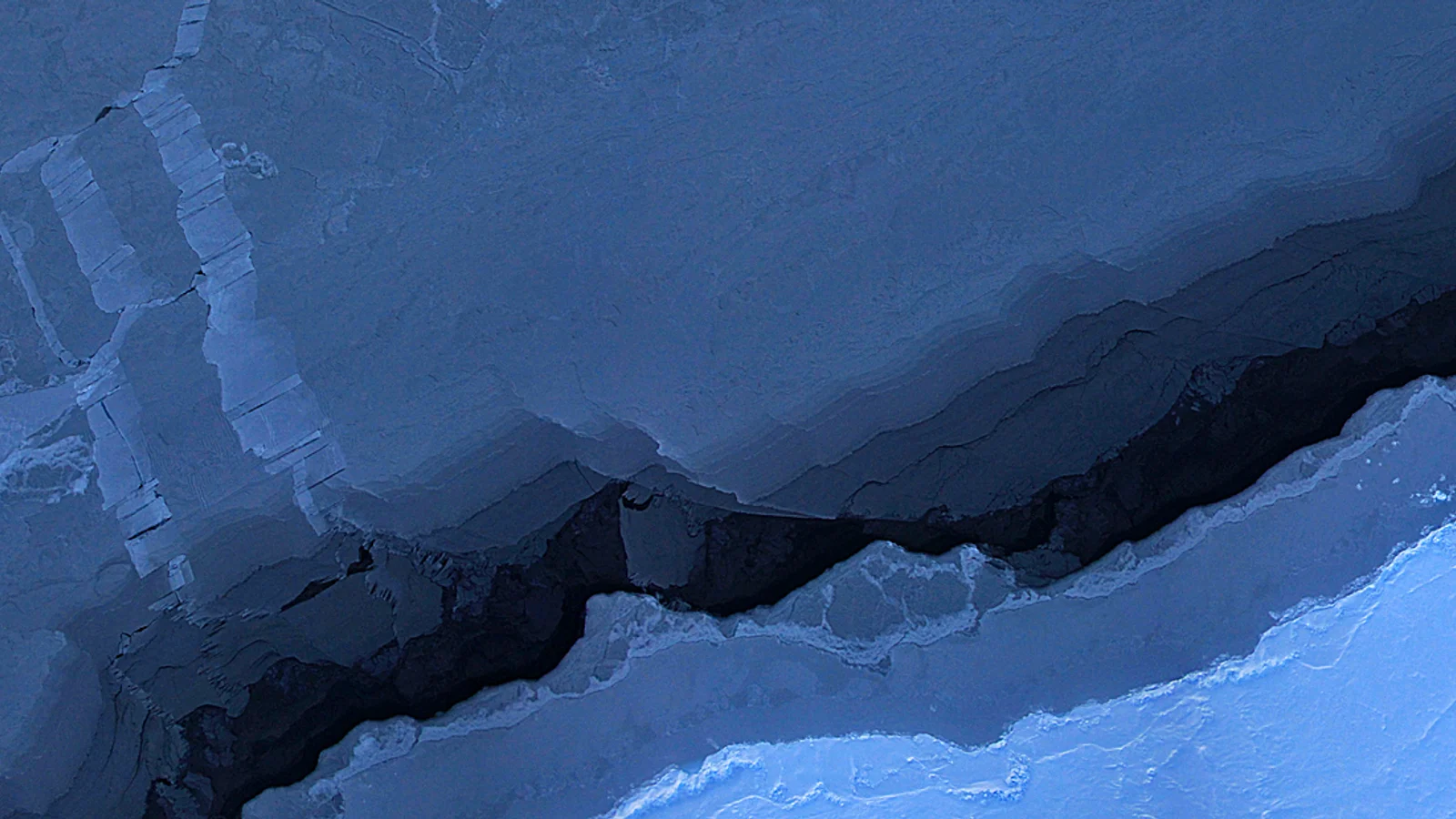Aerial mosaic of Beaufort Sea ice with a dark open-water lead, captured by the Digital Mapping System during Operation IceBridge